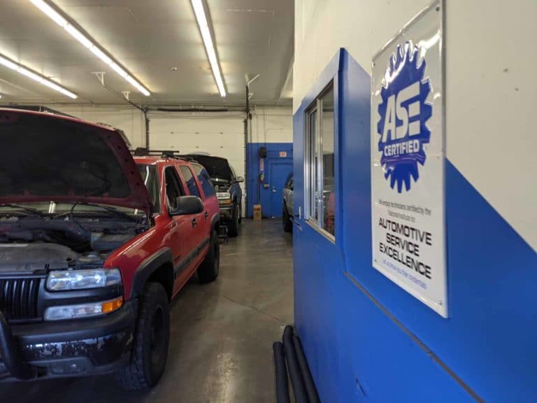 Brandy's Automotive. Bend, Oregon. Truck and car repair.Artistic view of ASE certified poster hanging in Brandy's Automotive garage
